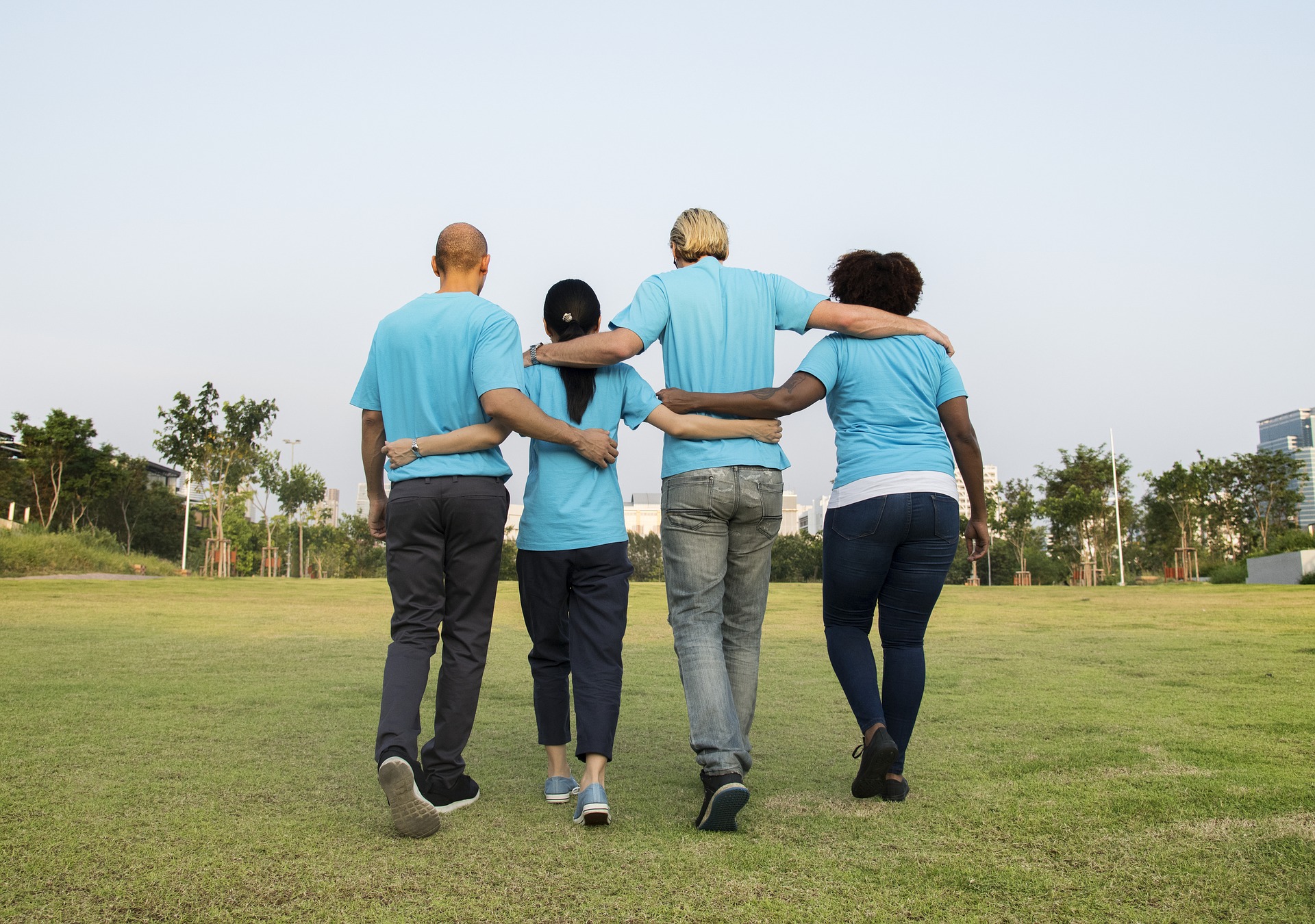 four people walking together