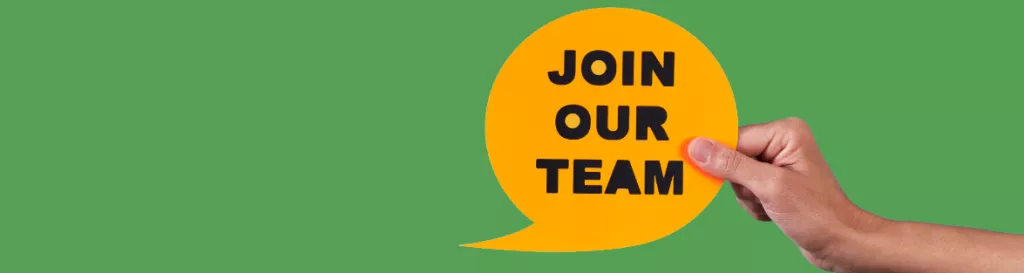 A hand holding a yellow speech bubble that reads: Join our team